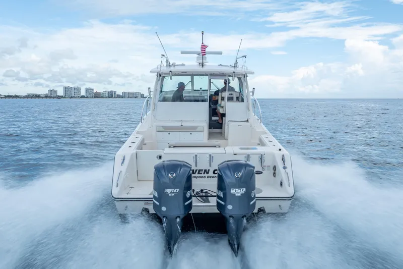 "seven C's" Yacht Photos Pics 2011 Pursuit OS 345 Offshore boat cruising on open water with twin Yamaha engines.