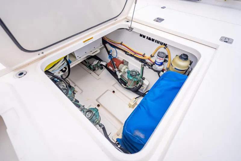 "seven C's" Yacht Photos Pics 2011 Pursuit OS 345 Offshore engine compartment with visible wiring and components.