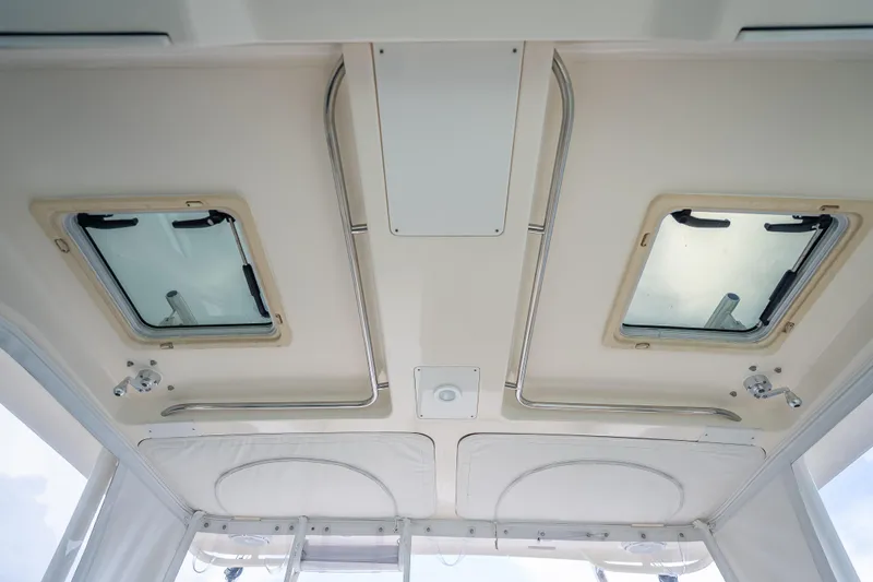 "seven C's" Yacht Photos Pics Ceiling view of 2011 Pursuit OS 345 Offshore boat cabin with hatches and lighting.
