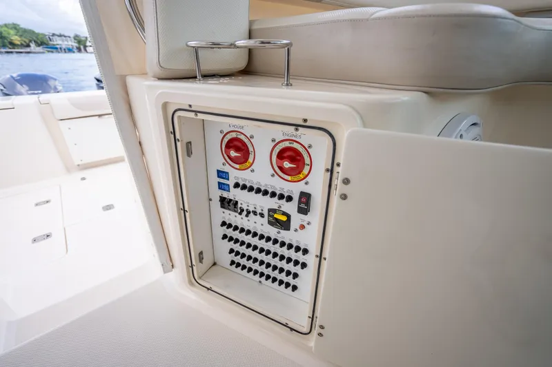 "seven C's" Yacht Photos Pics 2011 Pursuit OS 345 Offshore boat electrical panel with switches and controls.