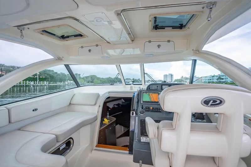 "seven C's" Yacht Photos Pics Interior of 2011 Pursuit OS 345 Offshore boat with modern helm and seating.