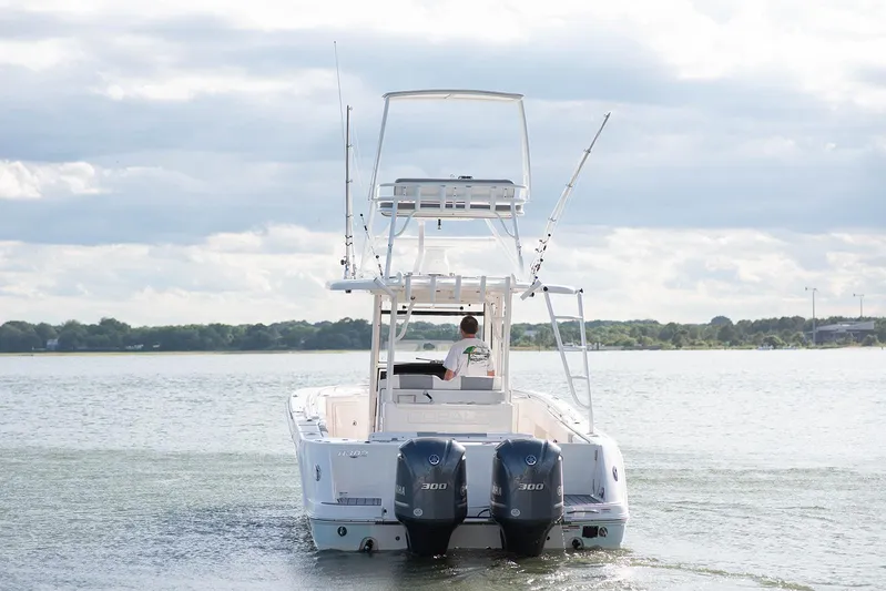  Yacht Photos Pics 2020 Robalo R302 CC boat with dual engines on a lake.