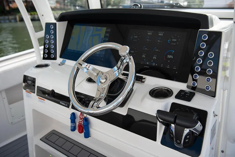  Yacht Photos Pics 2020 Robalo R302 CC boat helm with advanced navigation and control systems.