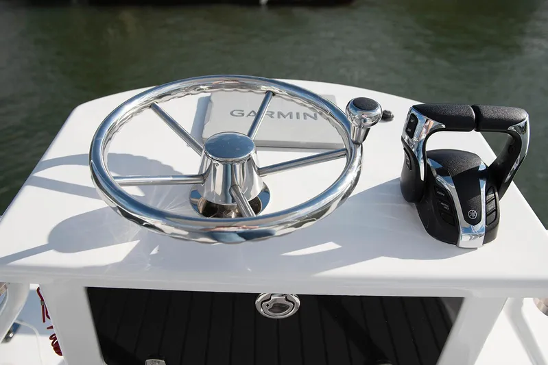  Yacht Photos Pics 2020 Robalo R302 CC boat helm with Garmin navigation and steering wheel.