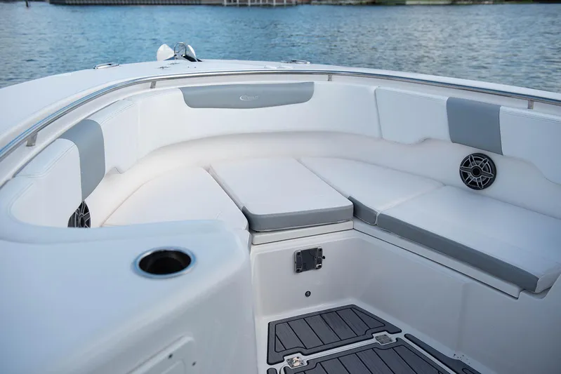  Yacht Photos Pics 2020 Robalo R302 CC boat with cushioned seating and cup holder on deck.