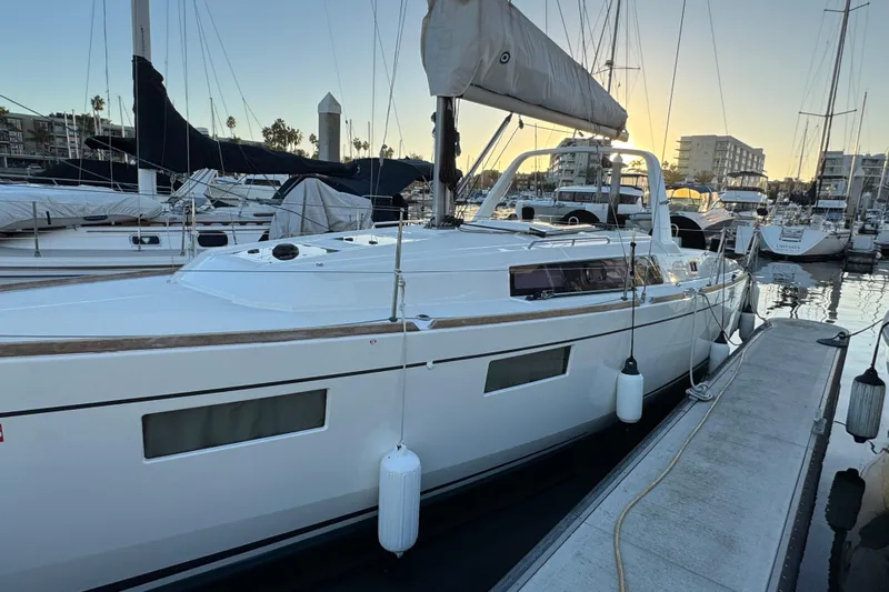 Barcelona Yacht Photos Pics 2021 Beneteau Oceanis 35.1 sailboat docked at marina during sunset.