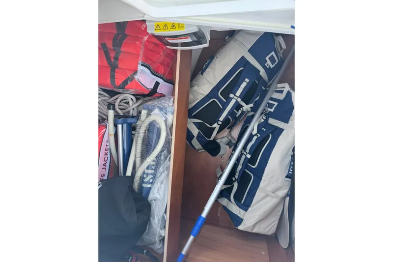 Barcelona Yacht Photos Pics Storage compartment of 2021 Beneteau Oceanis 35.1 with life jackets and sailing gear.