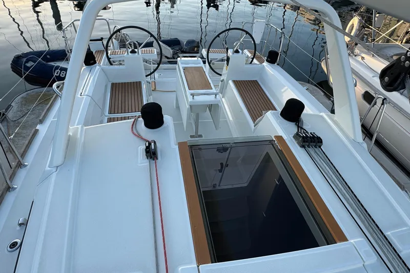 Barcelona Yacht Photos Pics 2021 Beneteau Oceanis 35.1 sailboat cockpit with dual steering wheels and teak flooring.