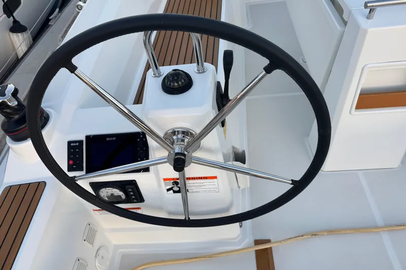Barcelona Yacht Photos Pics Steering wheel and controls of 2021 Beneteau Oceanis 35.1 sailboat cockpit.