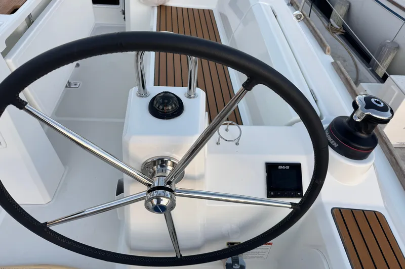 Barcelona Yacht Photos Pics Steering wheel and controls of a 2021 Beneteau Oceanis 35.1 sailboat cockpit.