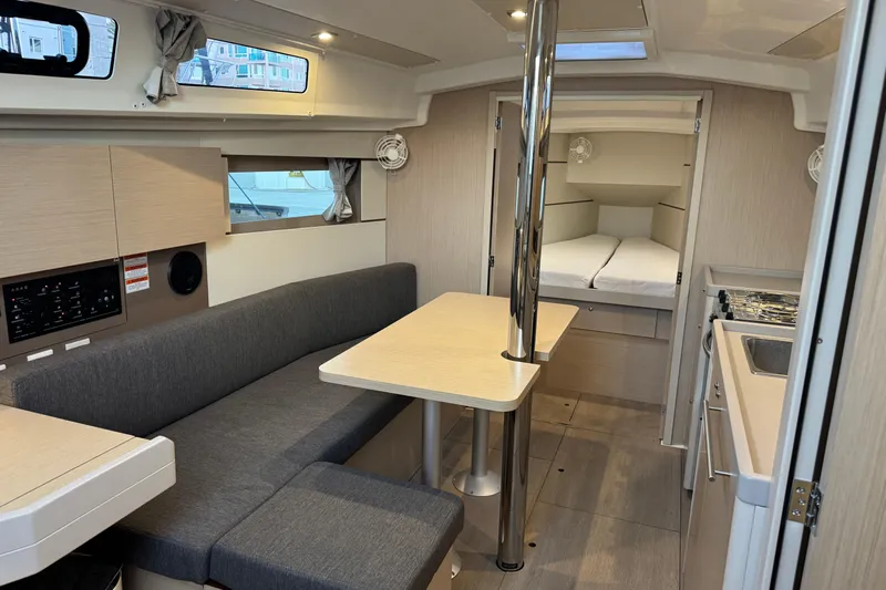 Barcelona Yacht Photos Pics Interior of 2021 Beneteau Oceanis 35.1 yacht with modern seating and sleeping area.