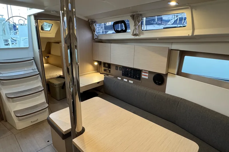 Barcelona Yacht Photos Pics Modern interior of 2021 Beneteau Oceanis 35.1 yacht with cozy seating and sleek design.