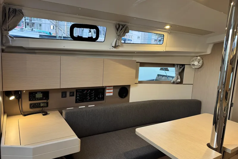 Barcelona Yacht Photos Pics Interior of 2021 Beneteau Oceanis 35.1 yacht with modern seating and navigation panel.