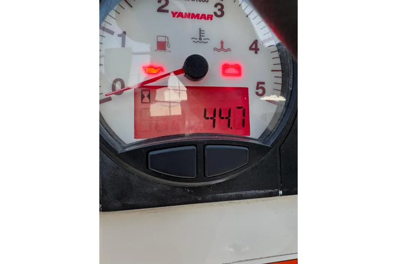 Barcelona Yacht Photos Pics Close-up of Yanmar engine gauge on 2021 Beneteau Oceanis 35.1, displaying 44.7 hours.