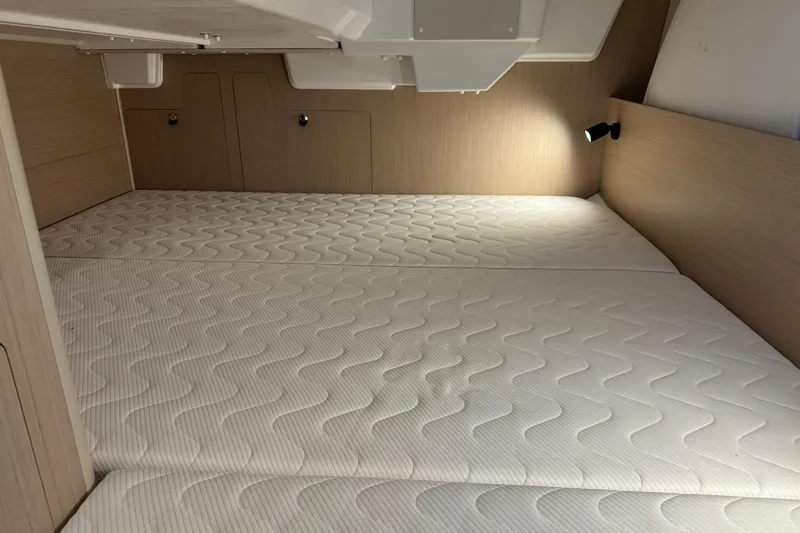 Barcelona Yacht Photos Pics Interior cabin of 2021 Beneteau Oceanis 35.1 yacht with comfortable bedding.