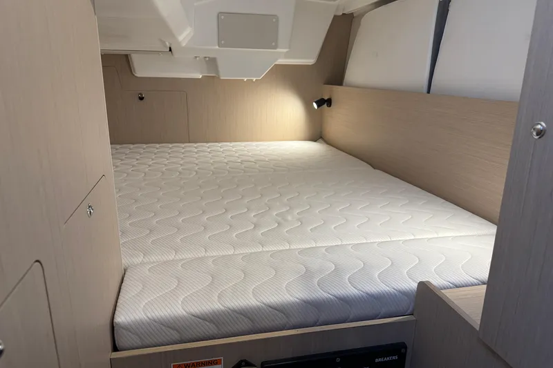 Barcelona Yacht Photos Pics Interior cabin of 2021 Beneteau Oceanis 35.1 with a comfortable bed setup.
