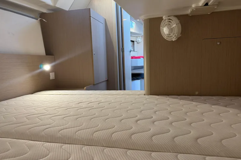 Barcelona Yacht Photos Pics Interior cabin of 2021 Beneteau Oceanis 35.1 yacht with cozy bed and modern design.