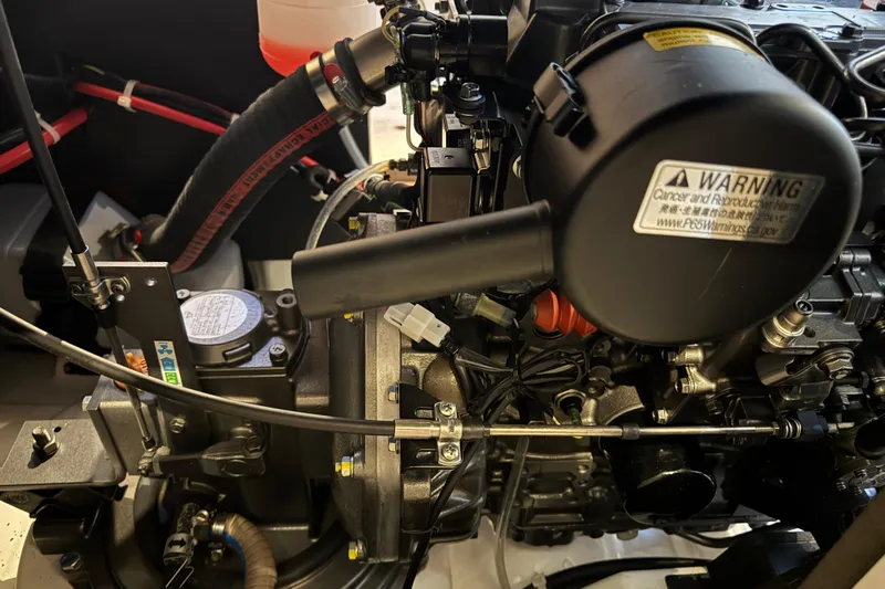 Barcelona Yacht Photos Pics Engine compartment of a 2021 Beneteau Oceanis 35.1 sailboat, showcasing mechanical components.