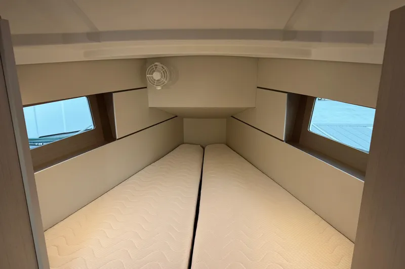 Barcelona Yacht Photos Pics Interior cabin of 2021 Beneteau Oceanis 35.1 yacht with twin beds and windows.