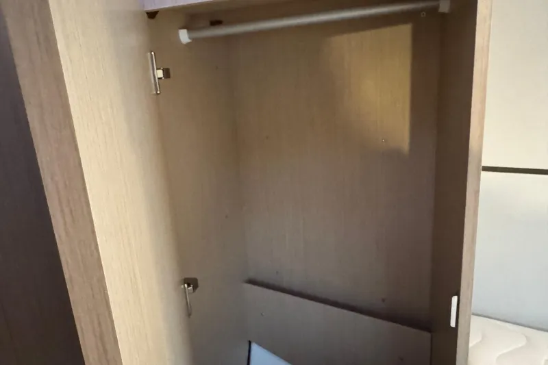 Barcelona Yacht Photos Pics Empty wooden closet inside 2021 Beneteau Oceanis 35.1 yacht.