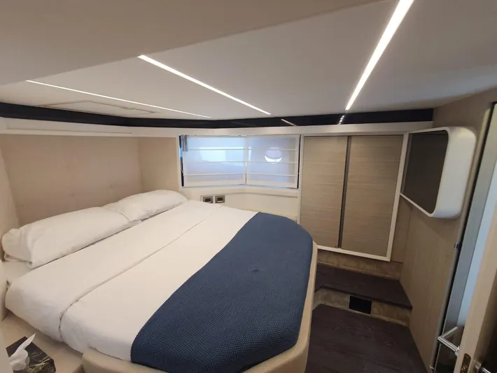 Avalon Yacht Photos Pics Luxurious cabin interior of 2023 Cranchi F 52 yacht with modern design and cozy bedding.