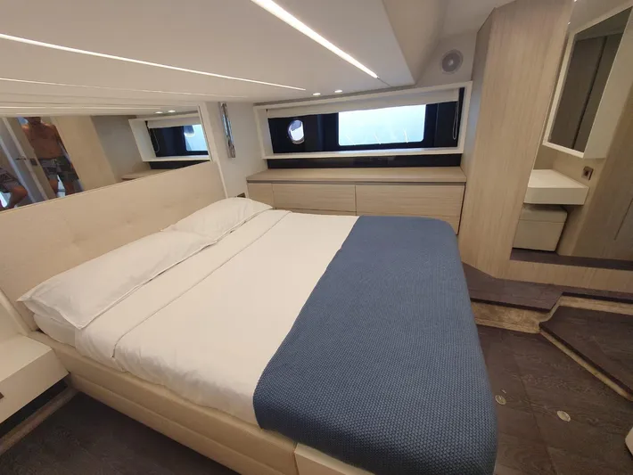 Avalon Yacht Photos Pics Luxurious bedroom interior of 2023 Cranchi F 52 yacht with modern design and cozy bedding.