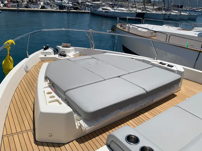 Avalon Yacht Photos Pics 2023 Cranchi F 52 yacht with sunbathing area, docked at marina.