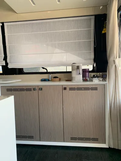 Avalon Yacht Photos Pics Modern kitchen interior in 2023 Cranchi F 52 yacht, featuring sleek cabinetry and appliances.