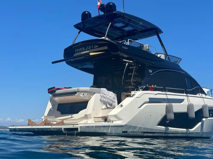 Avalon Yacht Photos Pics 2023 Cranchi F 52 yacht on water, sleek design, sunny day.