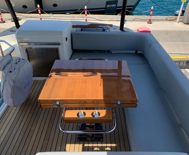 Avalon Yacht Photos Pics Luxury Cranchi F 52 yacht interior with wooden table and seating, 2023 model.