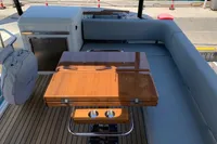 Luxury Cranchi F 52 yacht interior with wooden table and seating, 2023 model.