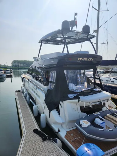 Avalon Yacht Photos Pics 2023 Cranchi F 52 yacht docked at marina, featuring sleek design and modern amenities.