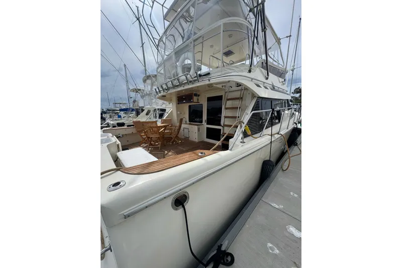 The Donut Hull Yacht Photos Pics 2002 Mikelson 50 Flybridge yacht docked, featuring spacious deck and flybridge.