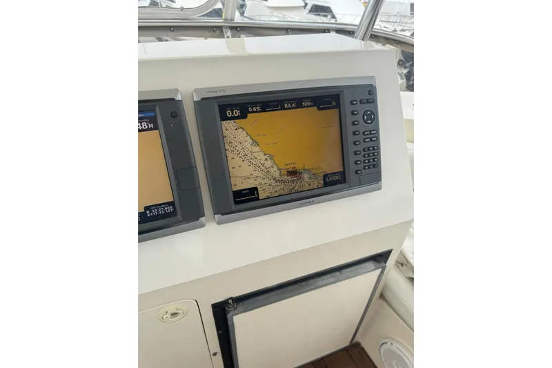 The Donut Hull Yacht Photos Pics Navigation system on 2002 Mikelson 50 Flybridge yacht's control panel.