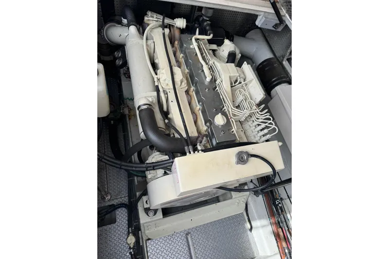 The Donut Hull Yacht Photos Pics Engine compartment of a 2002 Mikelson 50 Flybridge yacht, showcasing detailed components.