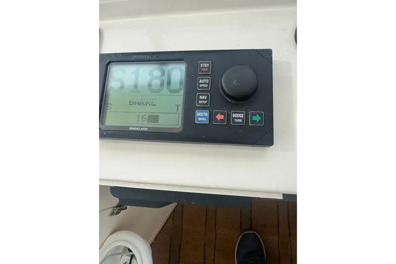 The Donut Hull Yacht Photos Pics Simrad AP20 autopilot control on 2002 Mikelson 50 Flybridge yacht dashboard.