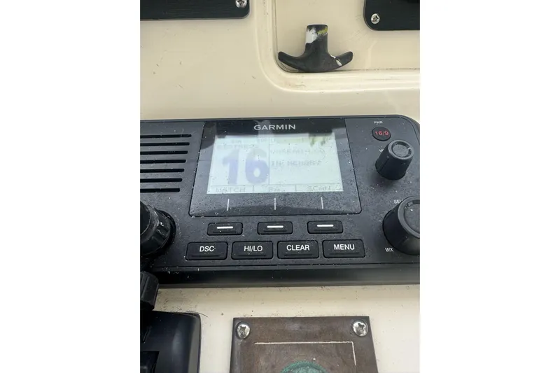 The Donut Hull Yacht Photos Pics Garmin marine radio on 2002 Mikelson 50 Flybridge boat dashboard.