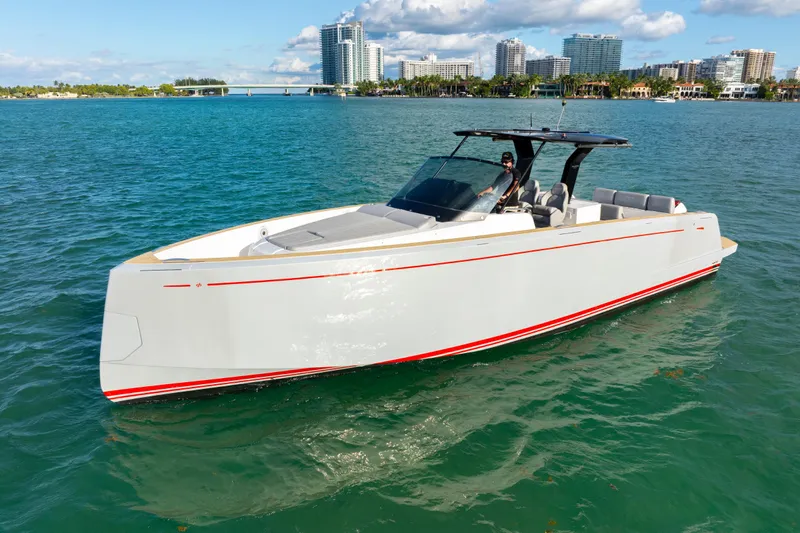  Yacht Photos Pics 2021 Pardo Yachts 38 cruising on blue water with city skyline in background.