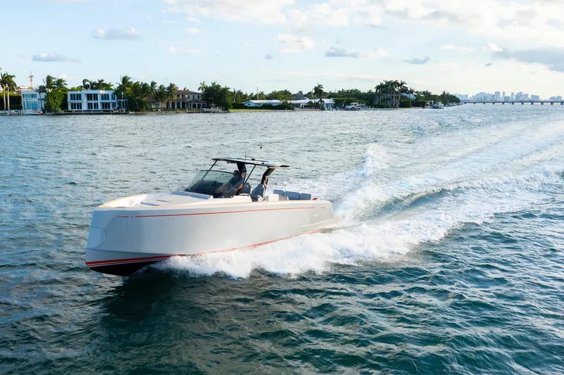  Yacht Photos Pics 2021 Pardo Yachts 38 cruising on a sunny day near waterfront homes.