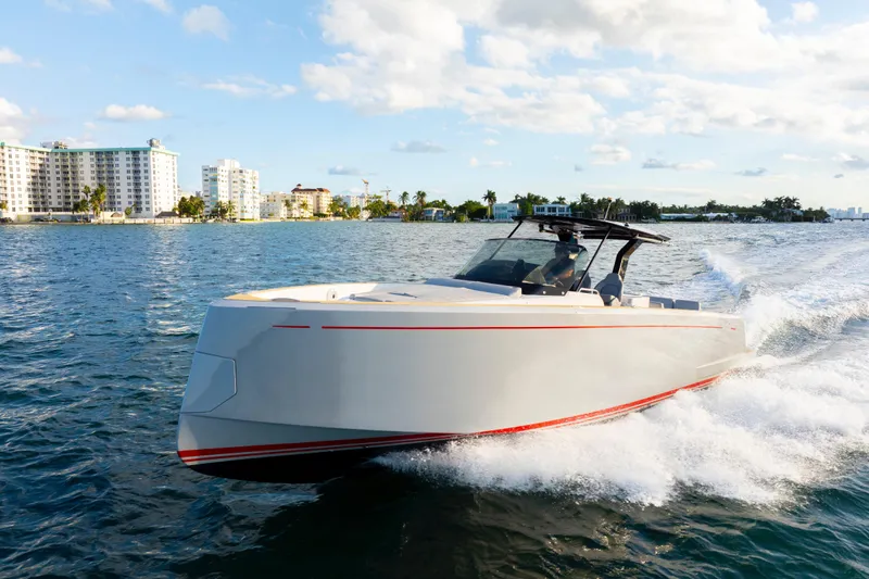  Yacht Photos Pics 2021 Pardo Yachts 38 cruising on water near coastal buildings.