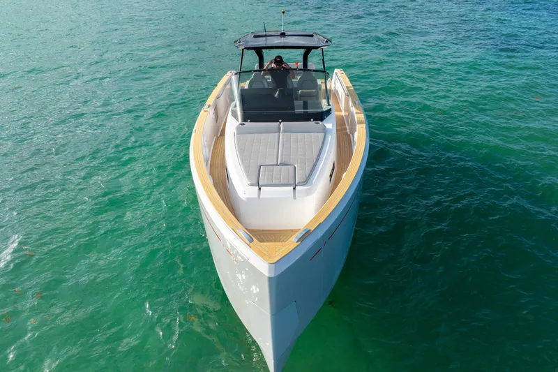  Yacht Photos Pics 2021 Pardo Yachts 38 cruising on clear turquoise water, showcasing sleek design and luxury.