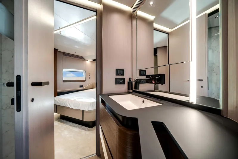  Yacht Photos Pics Luxurious interior of 2025 Azimut S8 yacht featuring modern bathroom and bedroom.