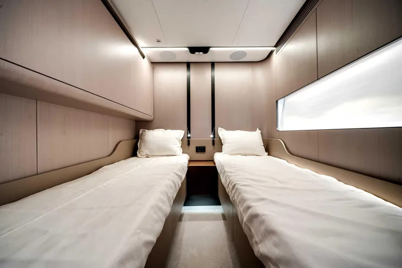  Yacht Photos Pics Luxurious twin cabin interior of 2025 Azimut S8 yacht, featuring modern design and comfortable bedding.