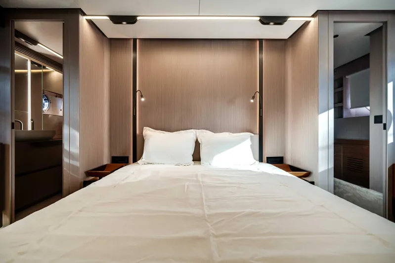  Yacht Photos Pics Luxurious bedroom interior of 2025 Azimut S8 yacht with modern design and ambient lighting.