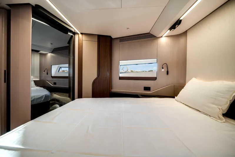  Yacht Photos Pics Luxurious interior of 2025 Azimut S8 yacht bedroom with modern design and elegant lighting.