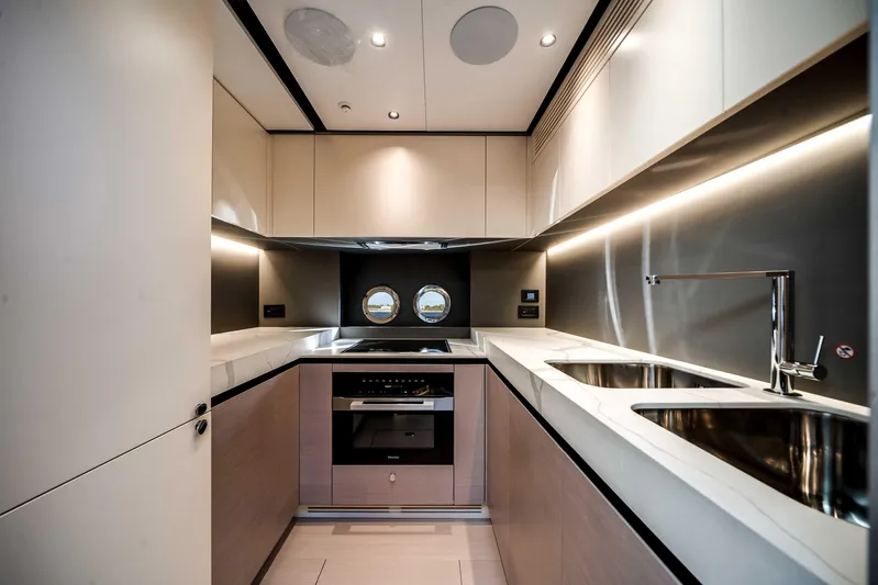  Yacht Photos Pics Luxurious kitchen interior of 2025 Azimut S8 yacht with modern appliances and sleek design.
