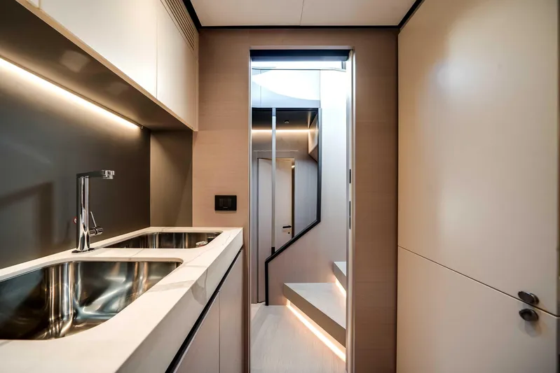  Yacht Photos Pics Modern kitchen interior of 2025 Azimut S8 yacht with sleek design and stainless steel sink.