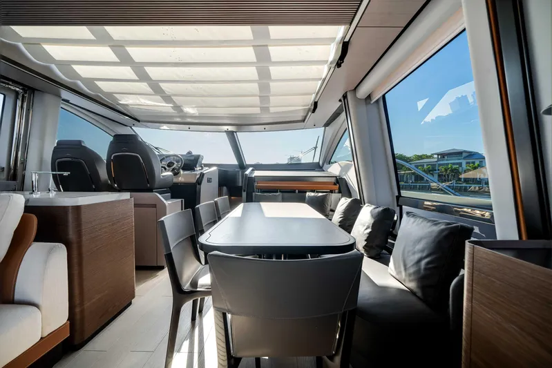  Yacht Photos Pics Luxurious interior of 2025 Azimut S8 yacht with modern dining area and panoramic windows.