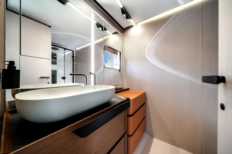  Yacht Photos Pics Luxurious bathroom interior of 2025 Azimut S8 yacht with modern sink and sleek design.