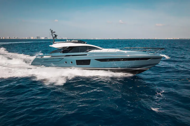  Yacht Photos Pics Luxury 2025 Azimut S8 yacht cruising on open sea under clear blue sky.